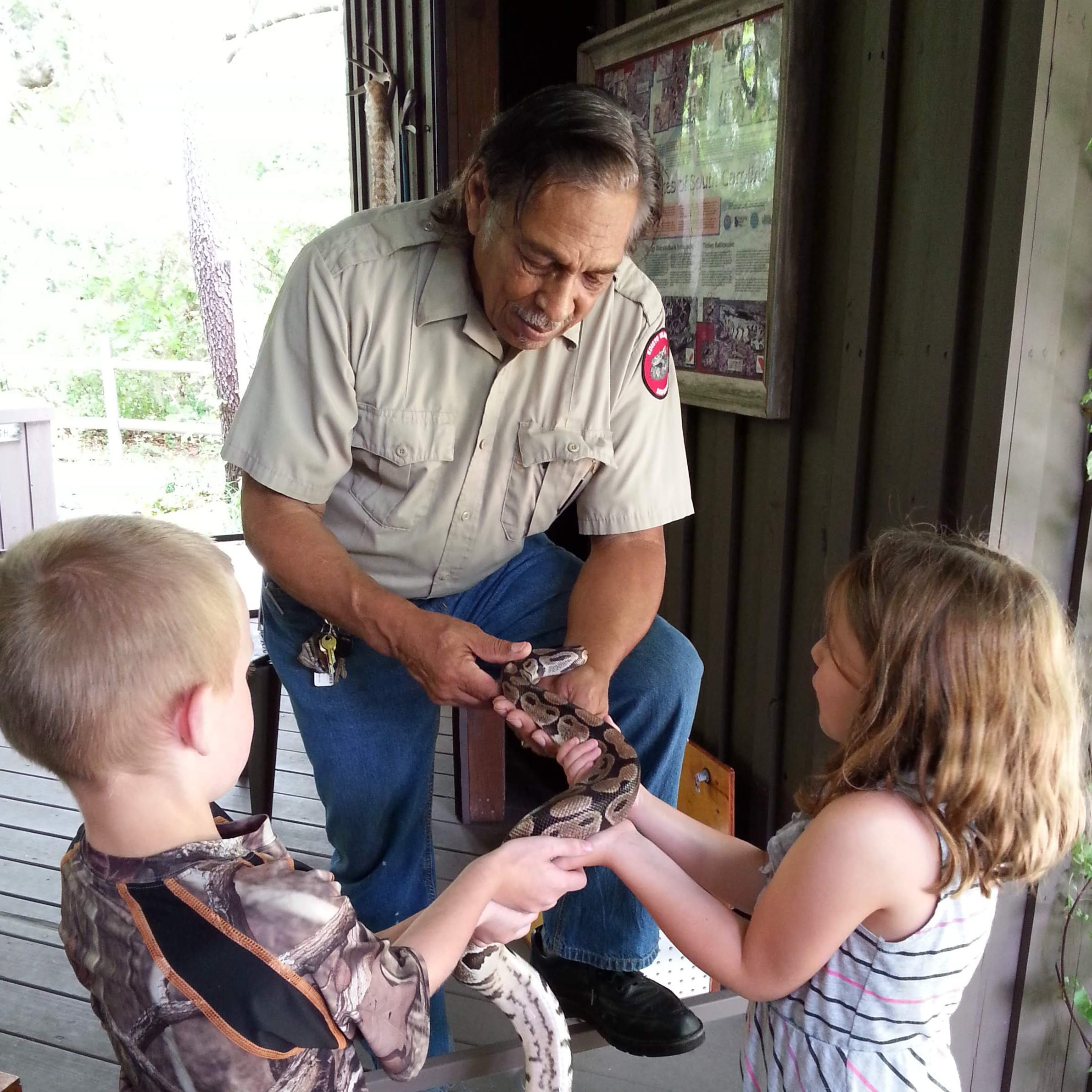 Florida snake handler Lawrence Van Sertima in June 2014 at the Edisto Island Serpentarium. (Wendy Jeffcoat Crider)