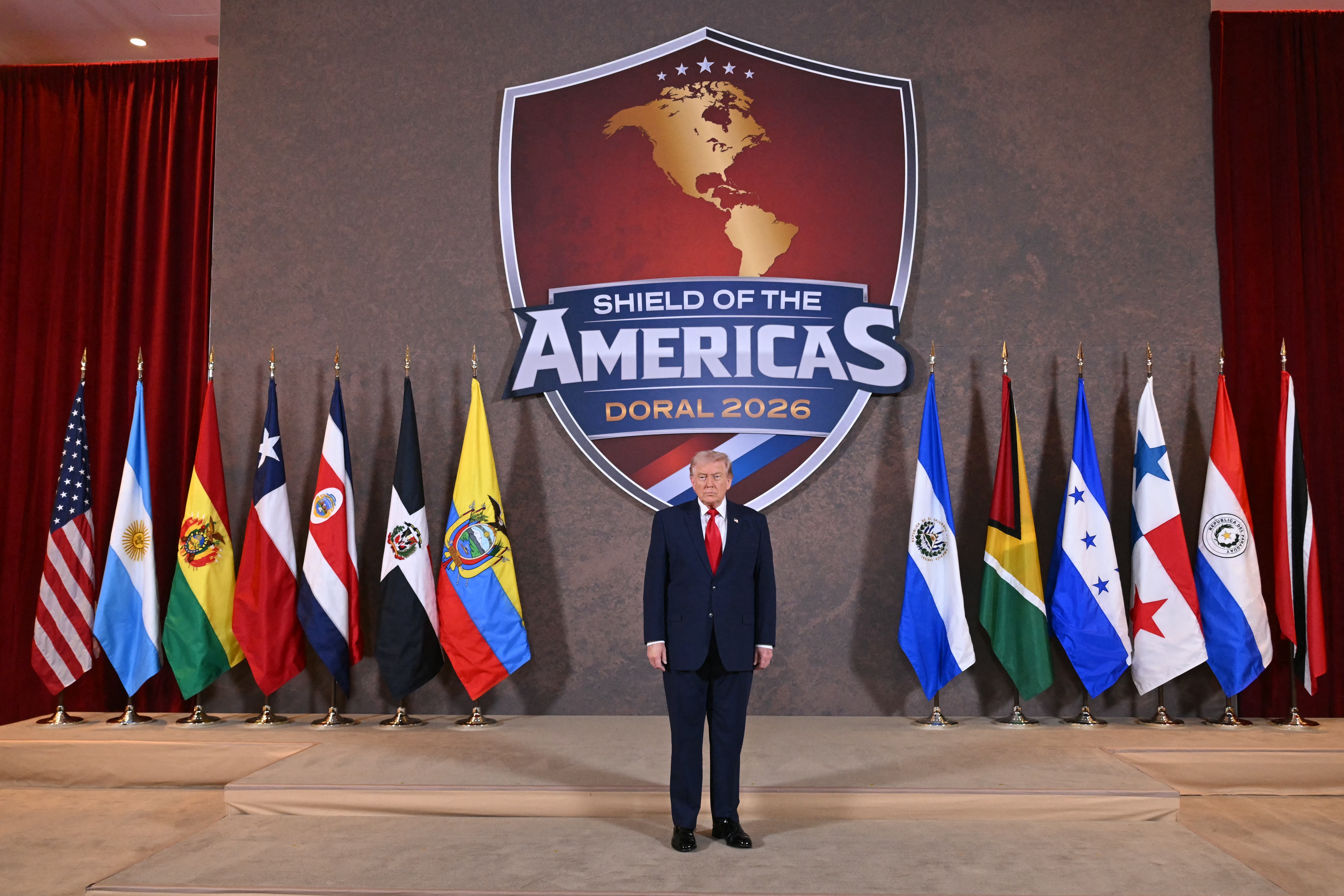 President Donald Trump poses at the start of the "Shield of the Americas" summit in Miami in March, where he discussed crime and immigration with Latin American leaders. (Saul Loeb/AFP/Getty Images)