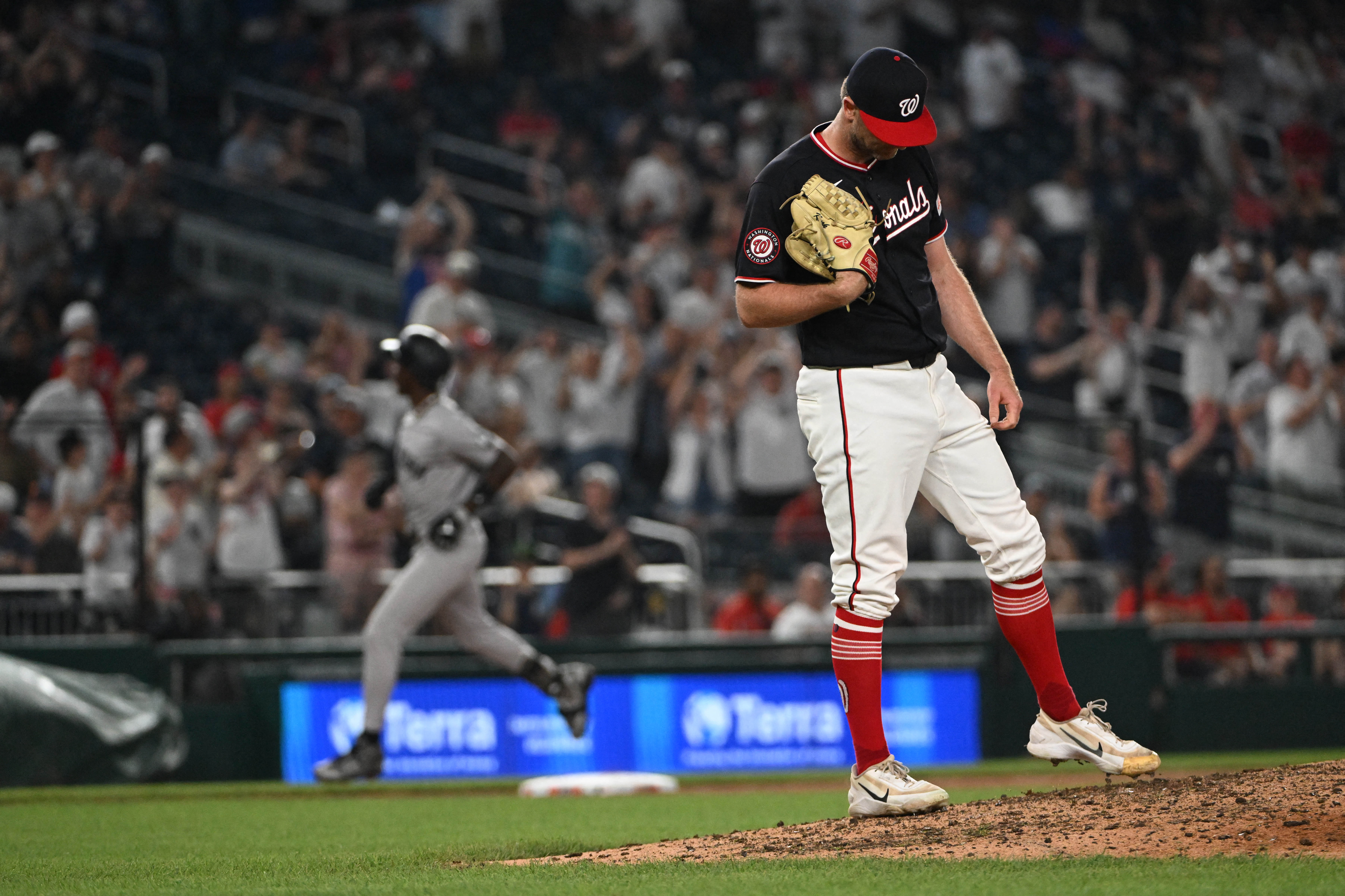 Nationals pitcher Matt Krook reacts after giving up a two-run home run to New York Yankees second baseman Jazz Chisholm Jr. during the ninth inning Friday at Nationals Park. (Brad Mills/Imagn Images/Reuters Connect)
