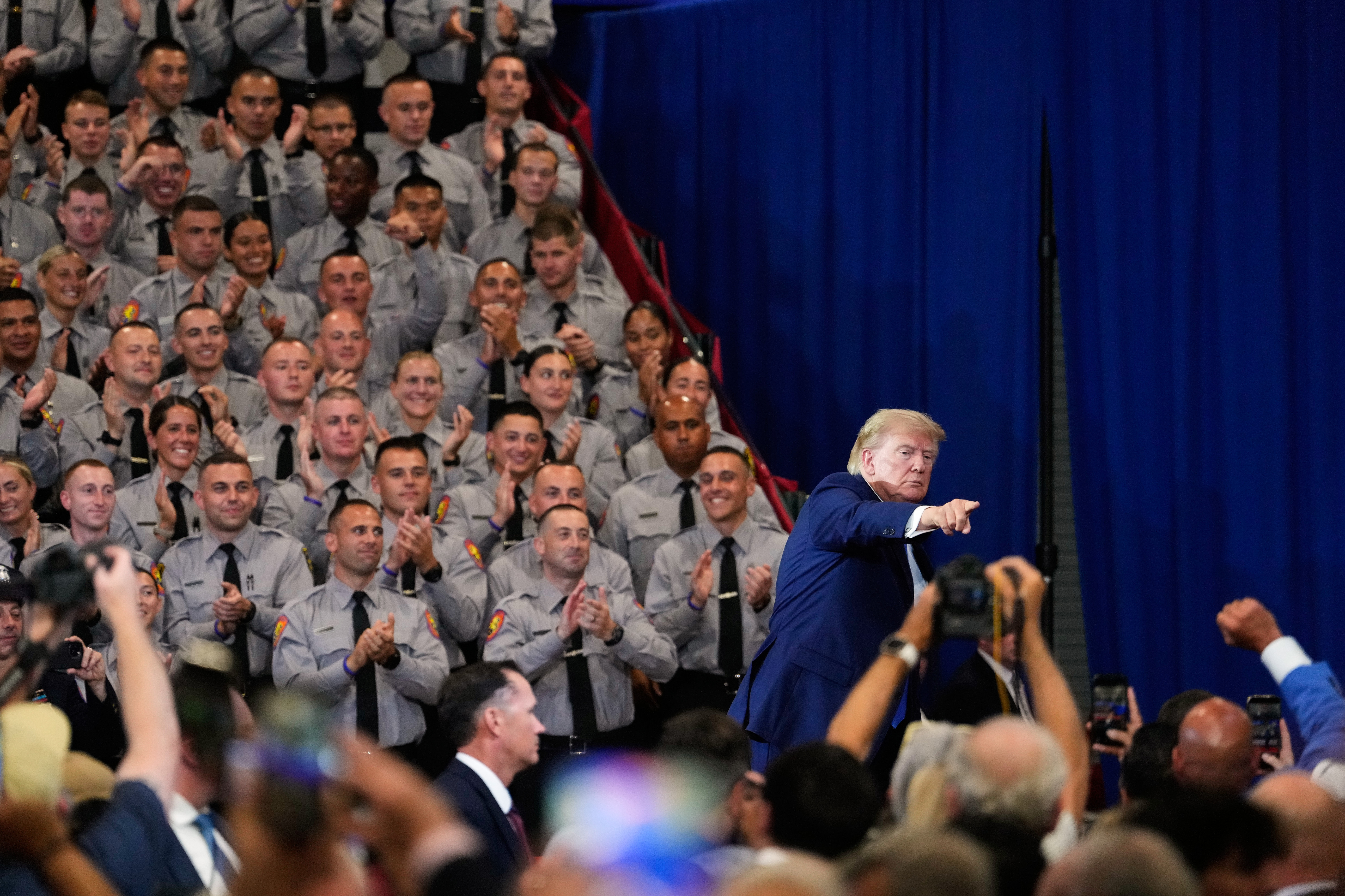 President Donald Trump leaves the stage after speaking in Garden City, New York. (Yuki Iwamura/AP)