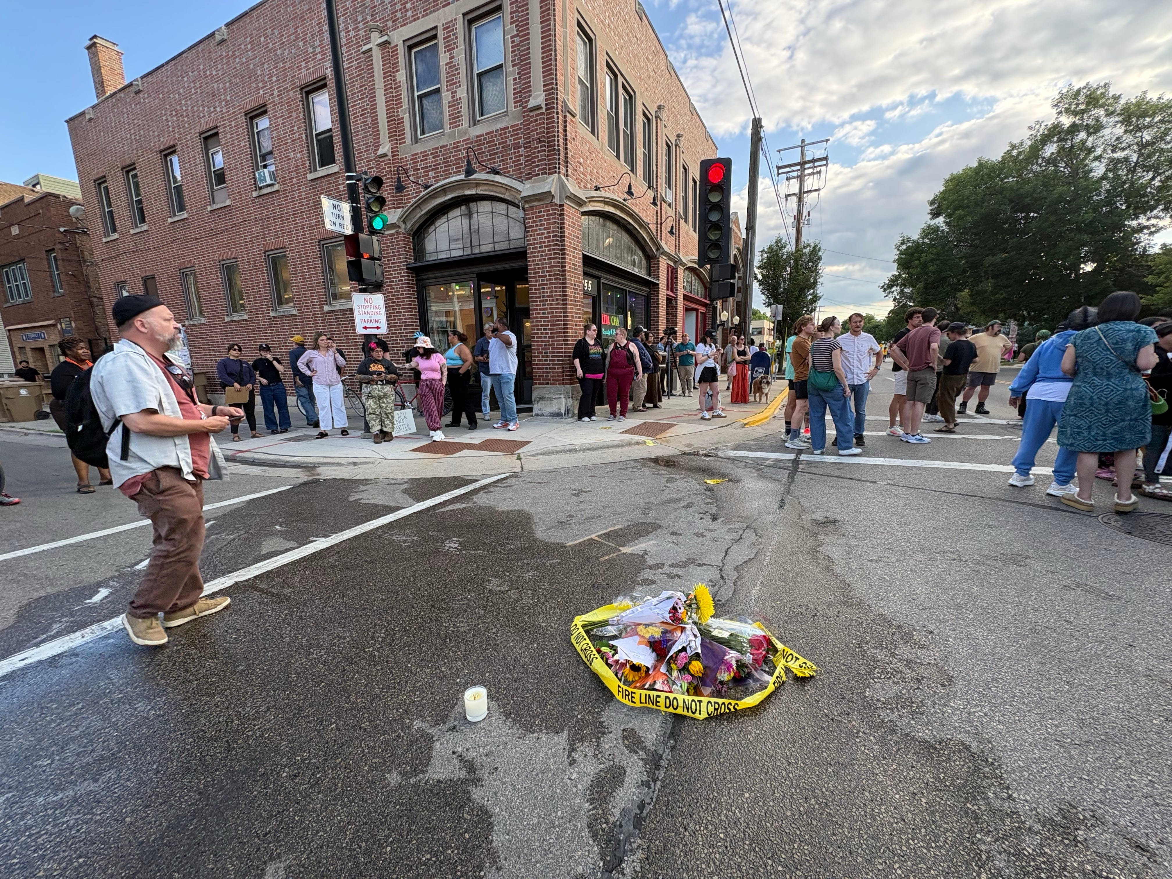 People gather at the scene of the shooting Wednesday in Madison. (Laura Schulte/Milwaukee Journal/USA Today Network/Reuters Connect)