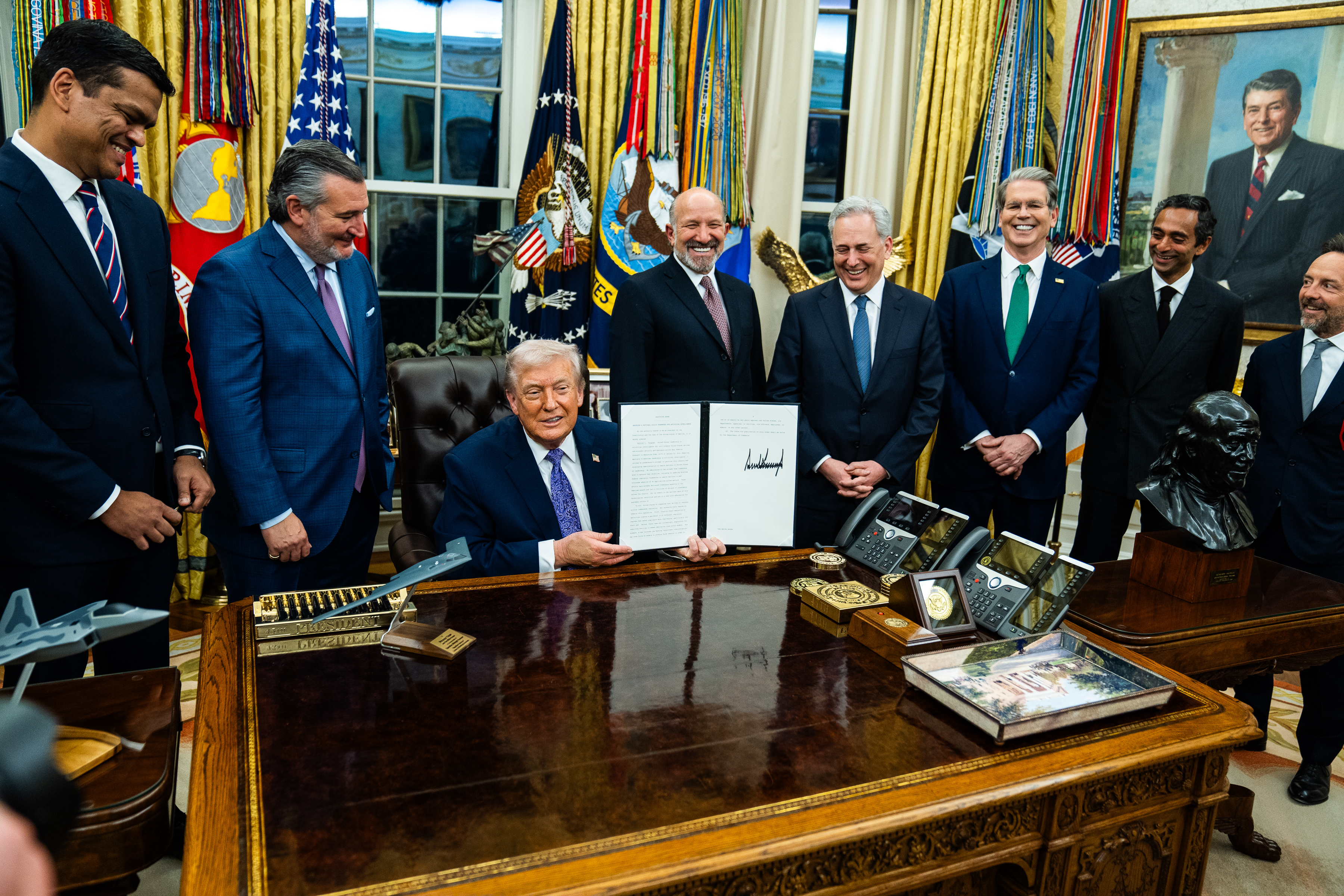 President Donald Trump shows off a signed executive order in December targeting onerous artificial intelligence regulations in states. (Demetrius Freeman/The Washington Post)