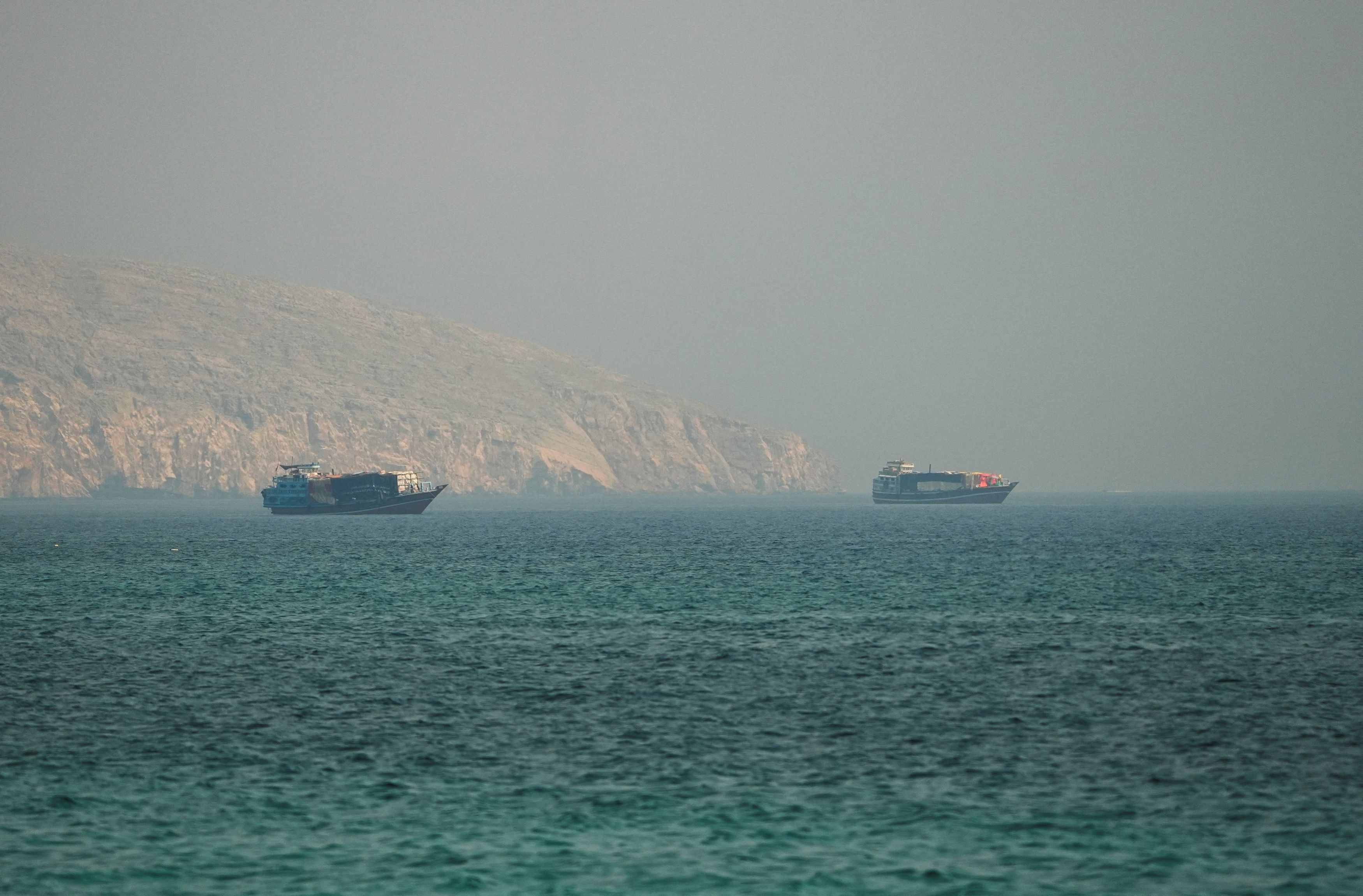 Vessels in the Strait of Hormuz, as seen from Musandam, Oman, on Thursday. (Reuters)