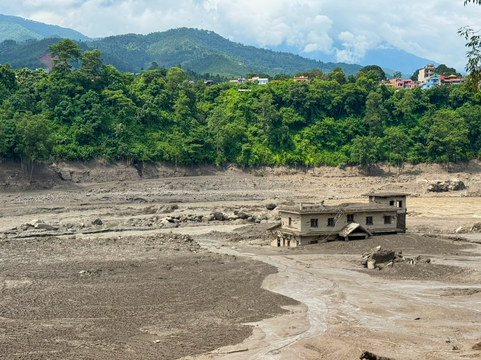 Collapsing glacier probably triggered Nepal floods that killed more than 250 in Nepal and China; rapid analysis calls it a harbinger of melting ice dangers