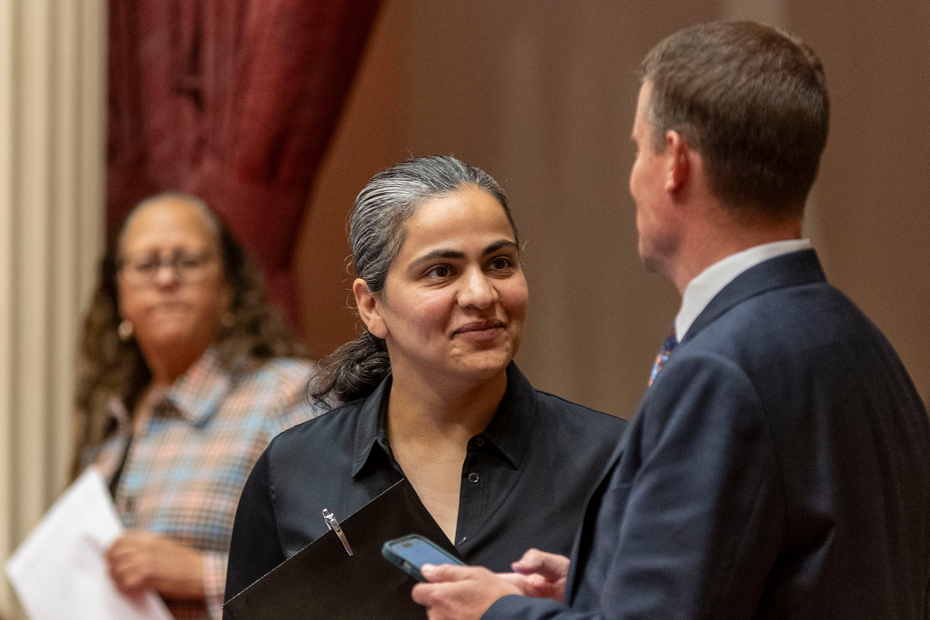 California state Sen. Aisha Wahab, center, in Sacramento in June. She will compete in a special runoff with transportation official Melissa Hernandez. (Annie Barker/AP)