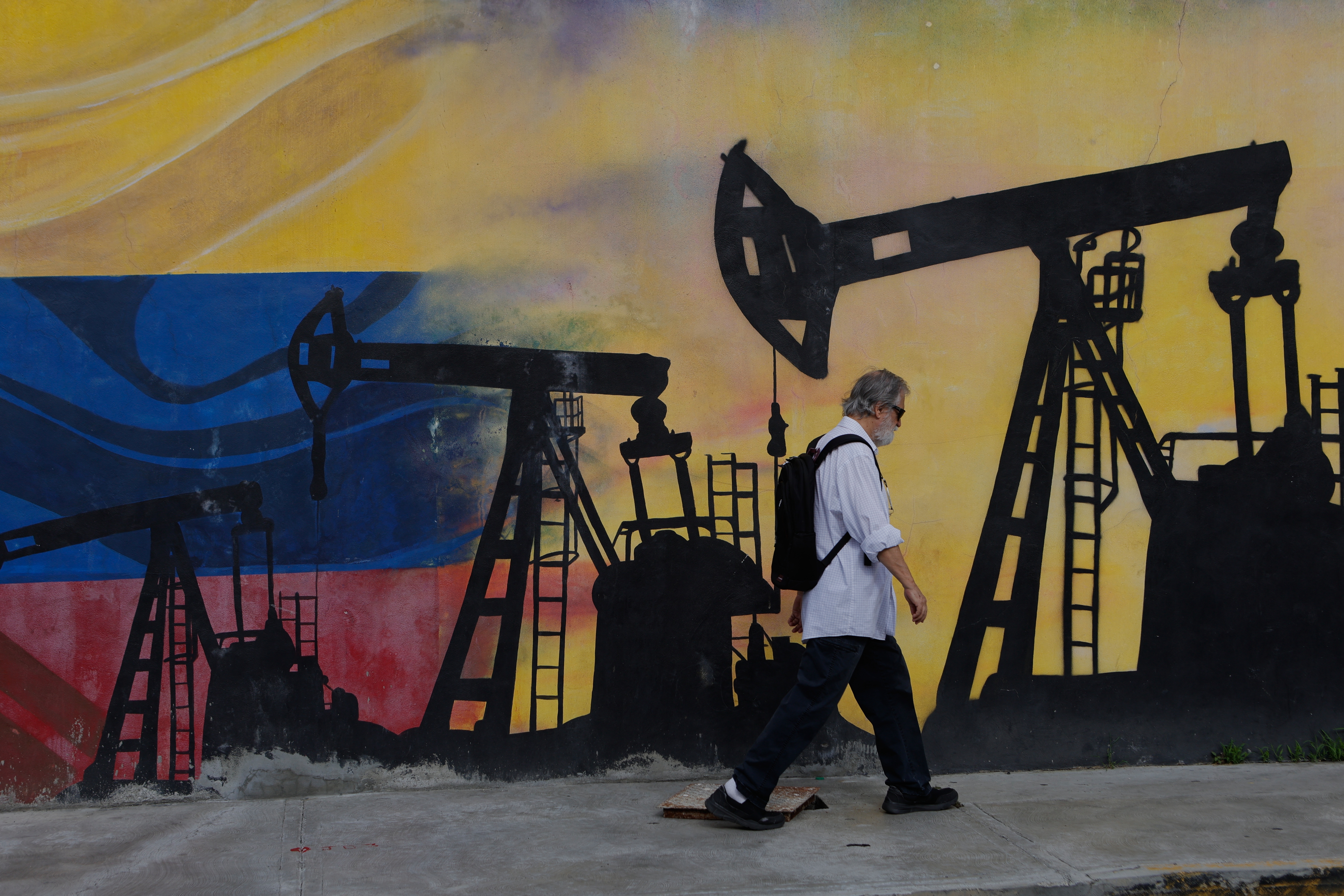A mural features oil wells in Caracas, Venezuela. (Pedro Mattey/AP)