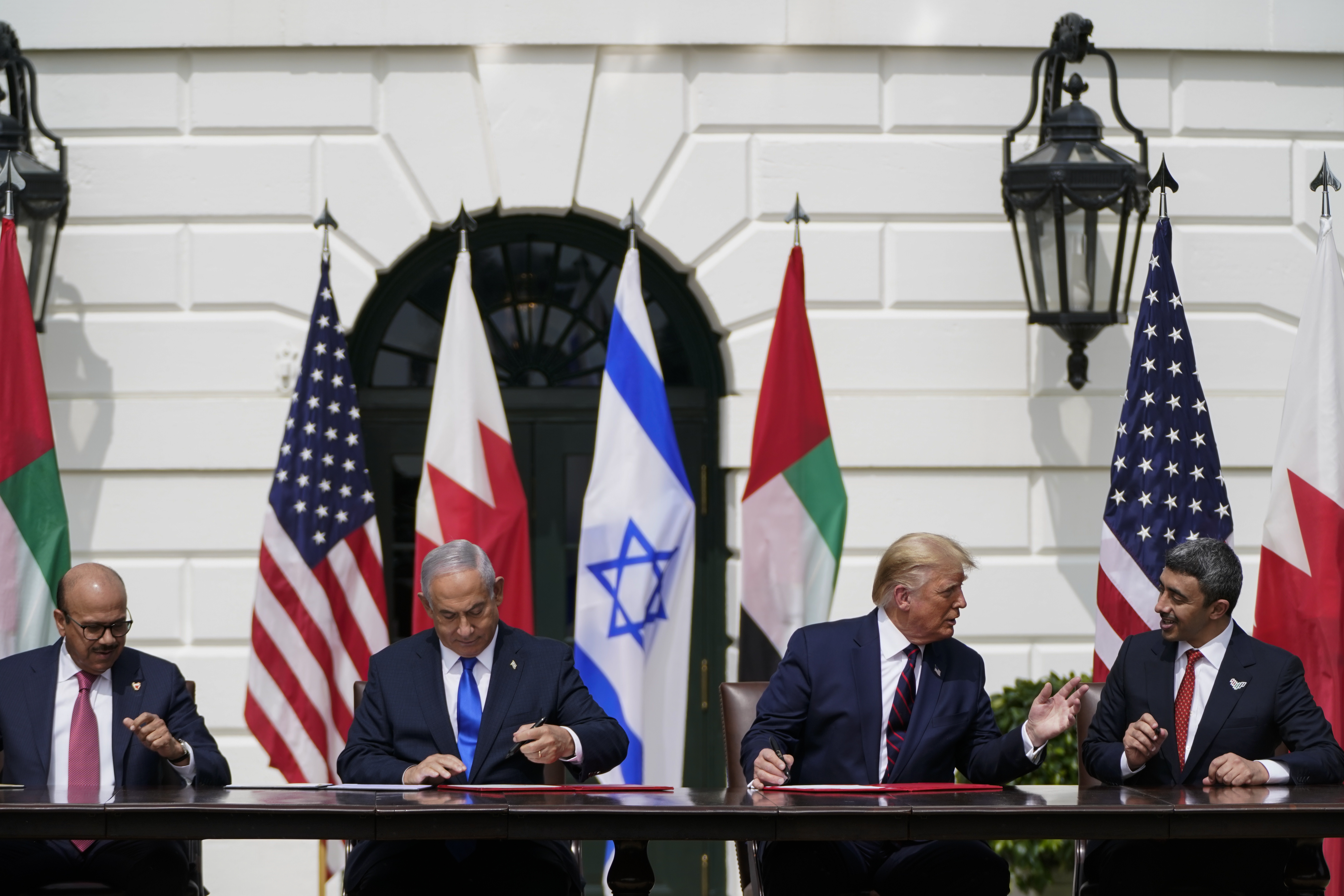 From left, Bahrain Foreign Minister Abdullatif al-Zayani, Israeli Prime Minister Benjamin Netanyahu, U.S. President Donald Trump, and United Arab Emirates Foreign Minister Abdullah bin Zayed al-Nahyan participate in the signing ceremony for the Abraham Accords at the White House on Sept. 15, 2020. (Jabin Botsford/The Washington Post)