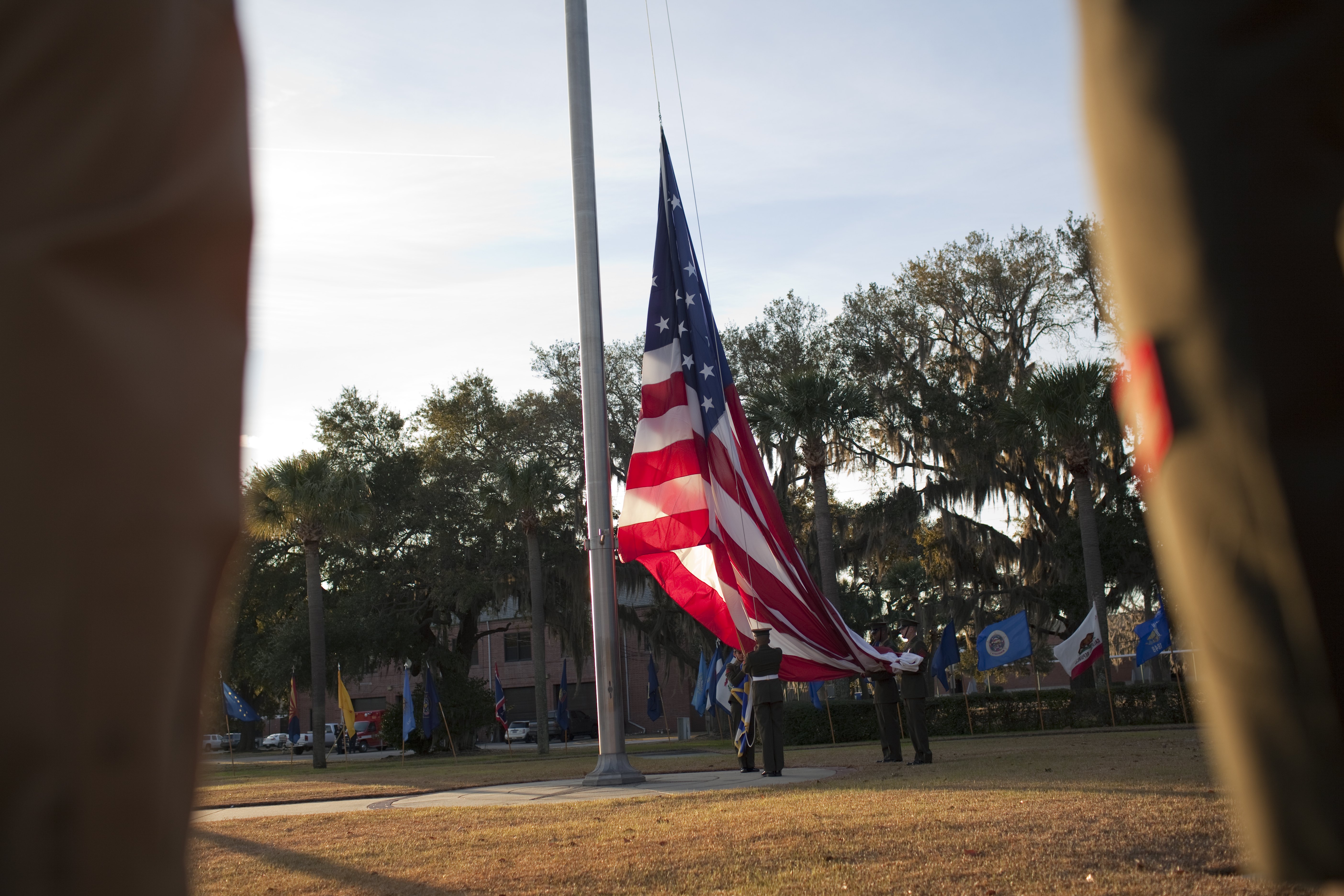Marines in dress uniforms raise the American flag before a Marine Corps recruit graduation ceremony at Parris Island, South Carolina. (Robert Nickelsberg/Getty Images)