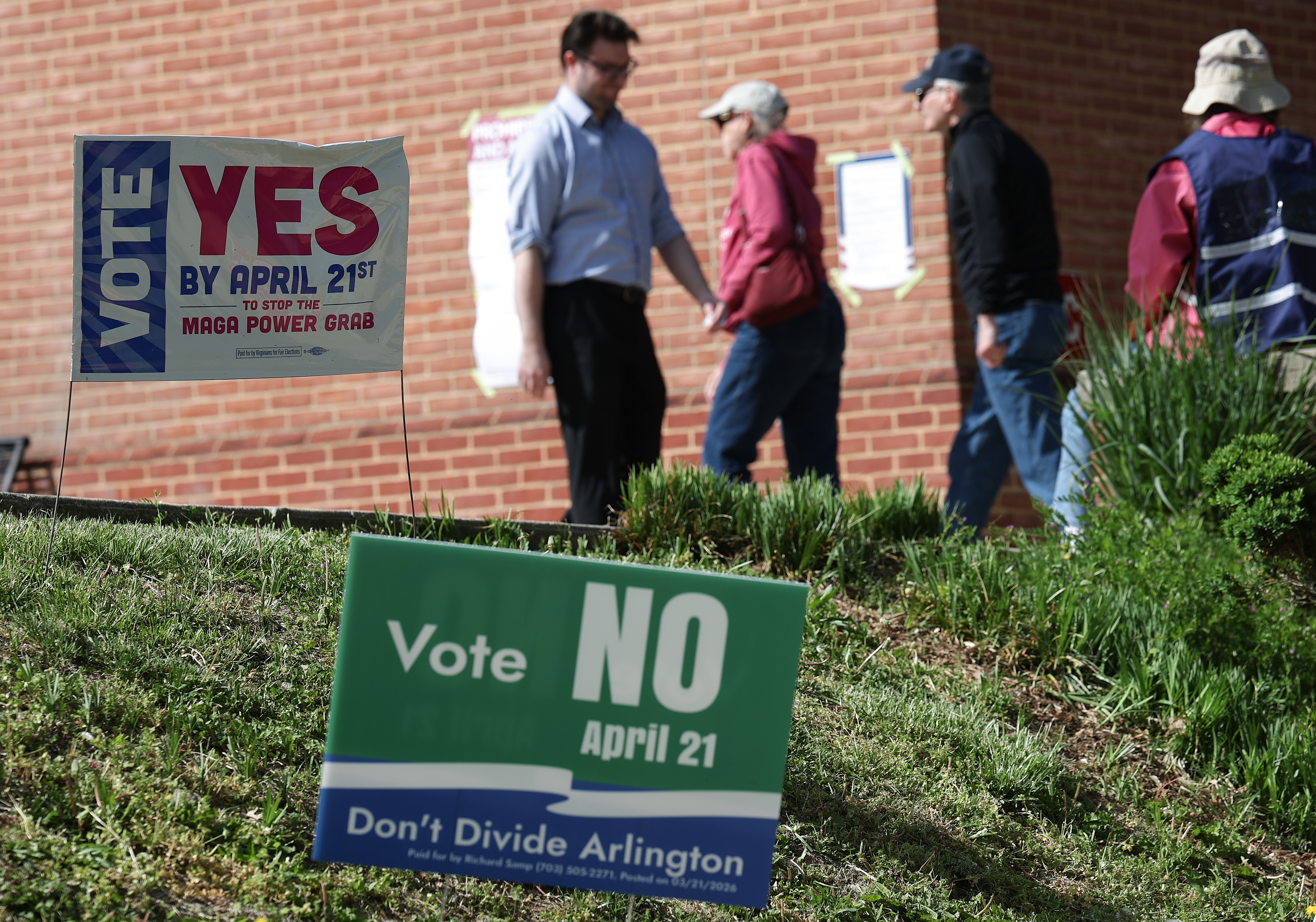 Voters arrive at a polling location in Arlington before casting their ballots for a redistricting ballot measure on April 21, 2026. (Win McNamee/Getty Images)