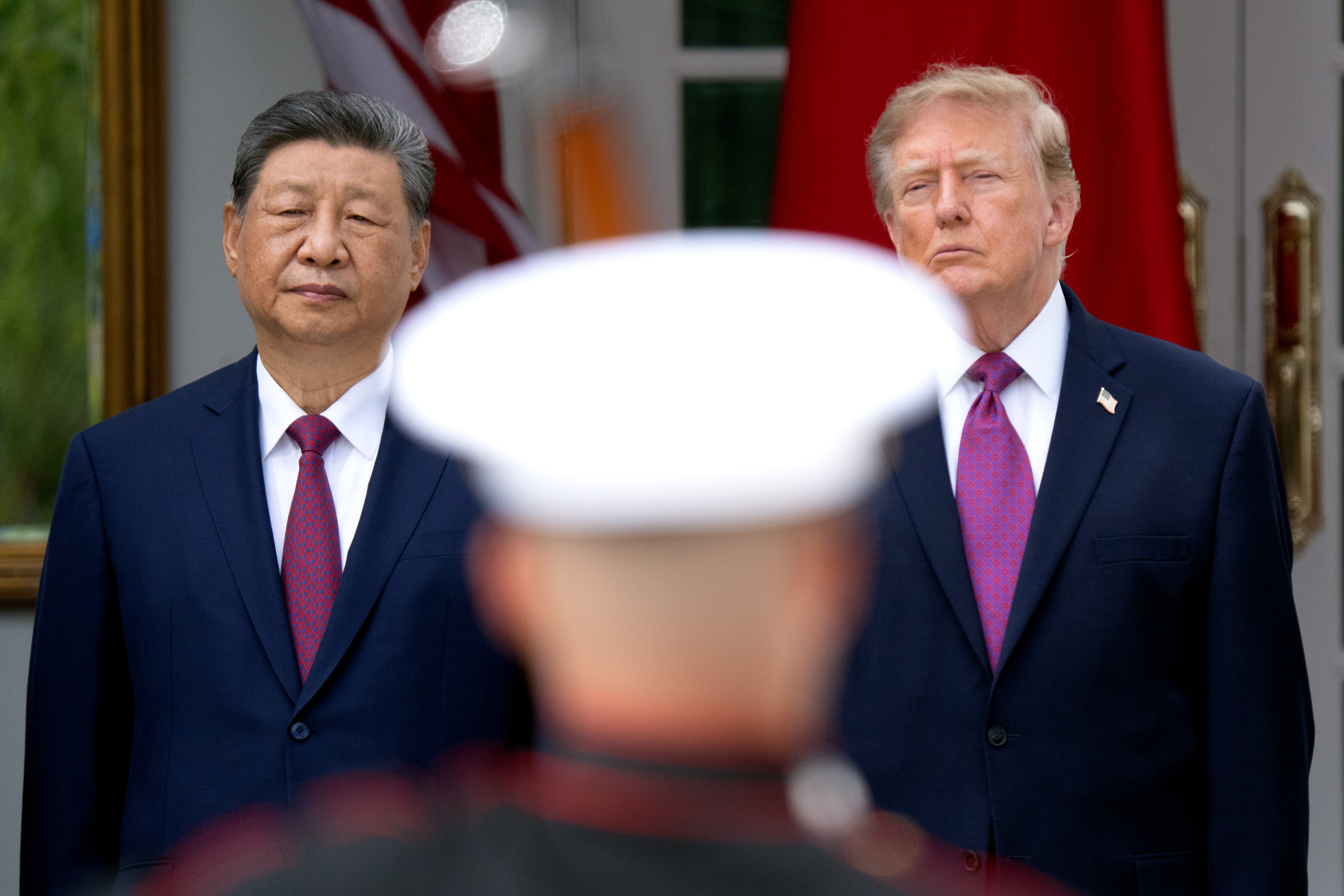 Chinese President Xi Jinping and President Donald Trump attend a military review in the Rose Garden at the White House on Thursday. (Peter W. Stevenson/The Washington Post)