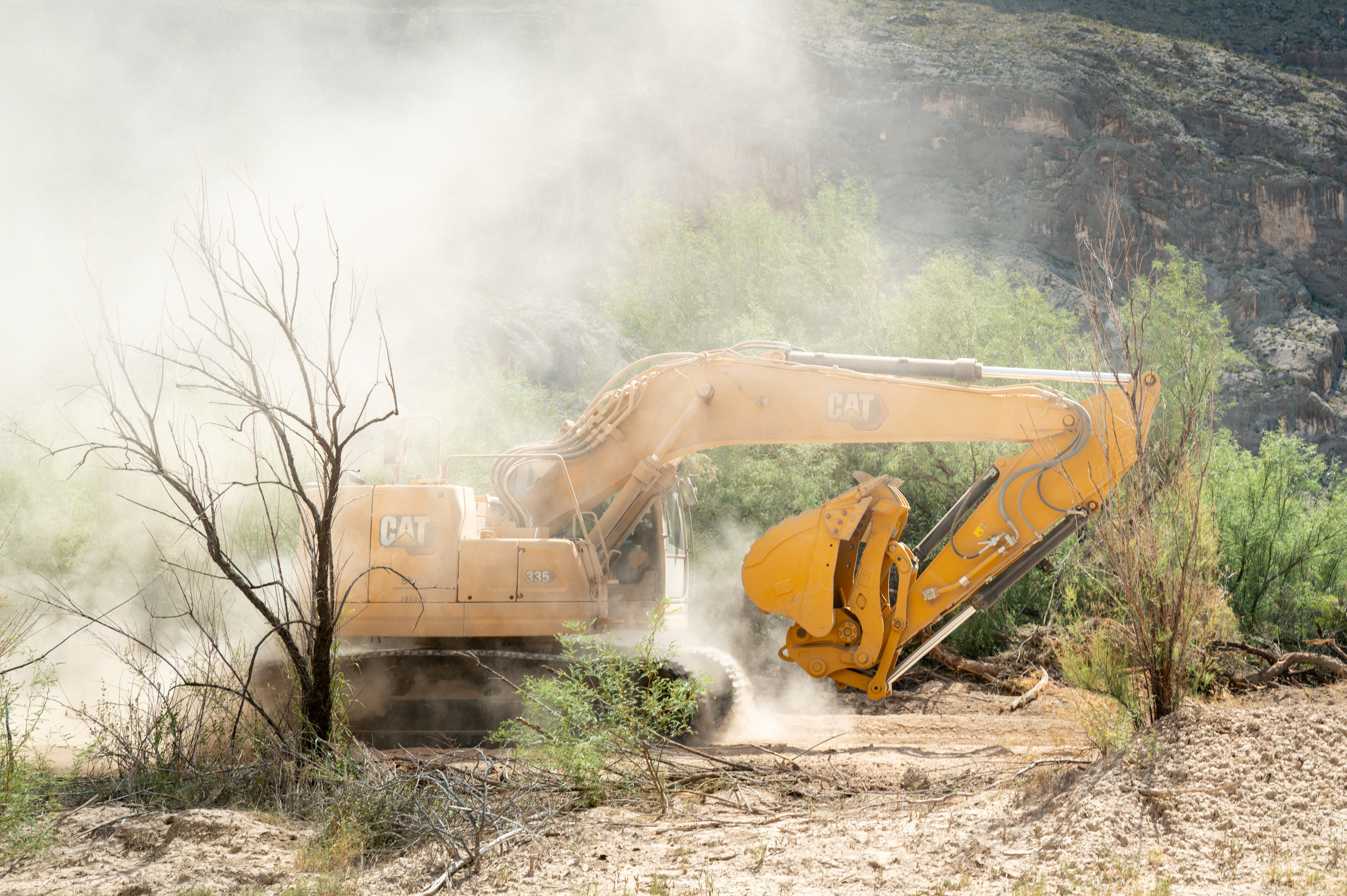 A bulldozer at work this month at Big Bend National Park in Texas. Customs and Border Protection Commissioner Rodney Scott said in a video that work on a border patrol road there would be paused pending a “personal evaluation.” (Brandon Bell/Getty Images)