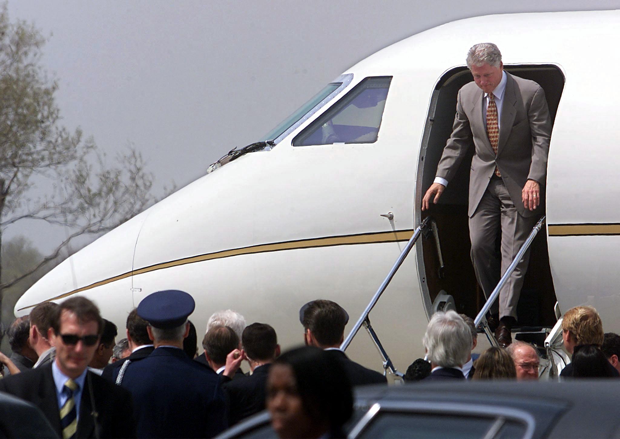 President Bill Clinton disembarks from an unmarked jet in Islamabad, Pakistan, in March 2000. (Stephen Jaffe/AFP/Getty Images)