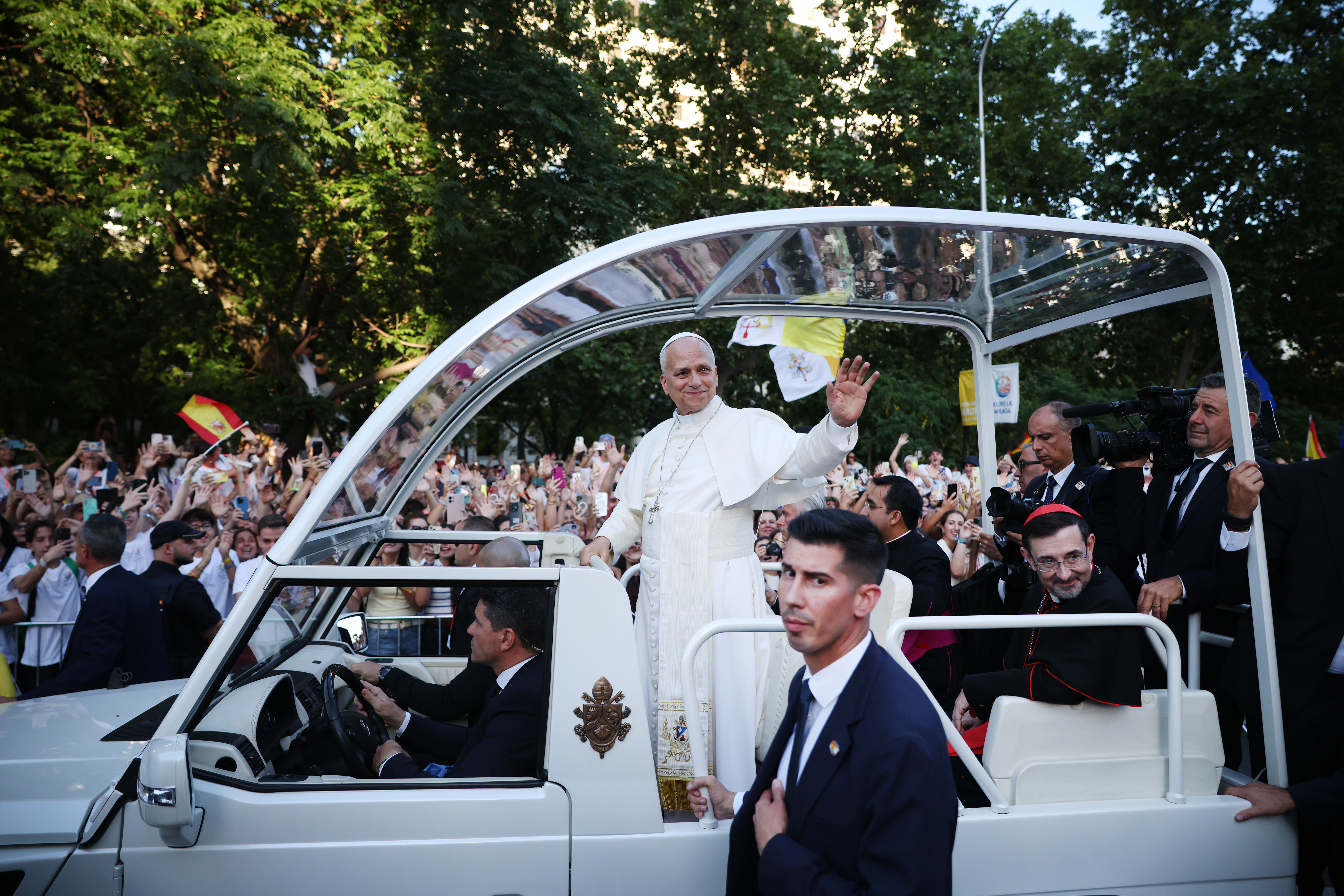 Pope Leo XIV waving to crowds in Madrid ahead of a Mass on the first day of his week-long visit to Spain. (Dan Kitwood/Getty Images)