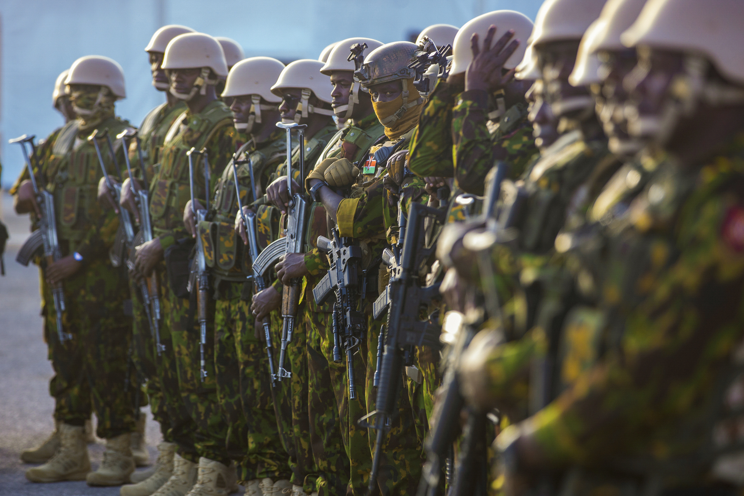 Kenyan police stand at their base in Port-au-Prince, Haiti, during a visit by Garry Conille, then the country’s acting prime minister, on June 26, 2024. The first contingent of U.N.-backed foreign police arrived the previous day. (Marckinson Pierre/AP)