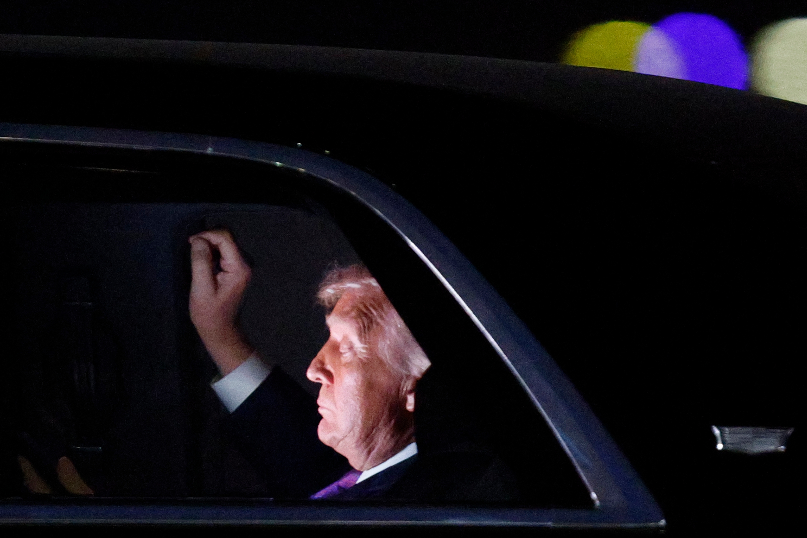 President Donald Trump in his limousine at Joint Base Andrews in Maryland. (Luis M. Alvarez/AP)