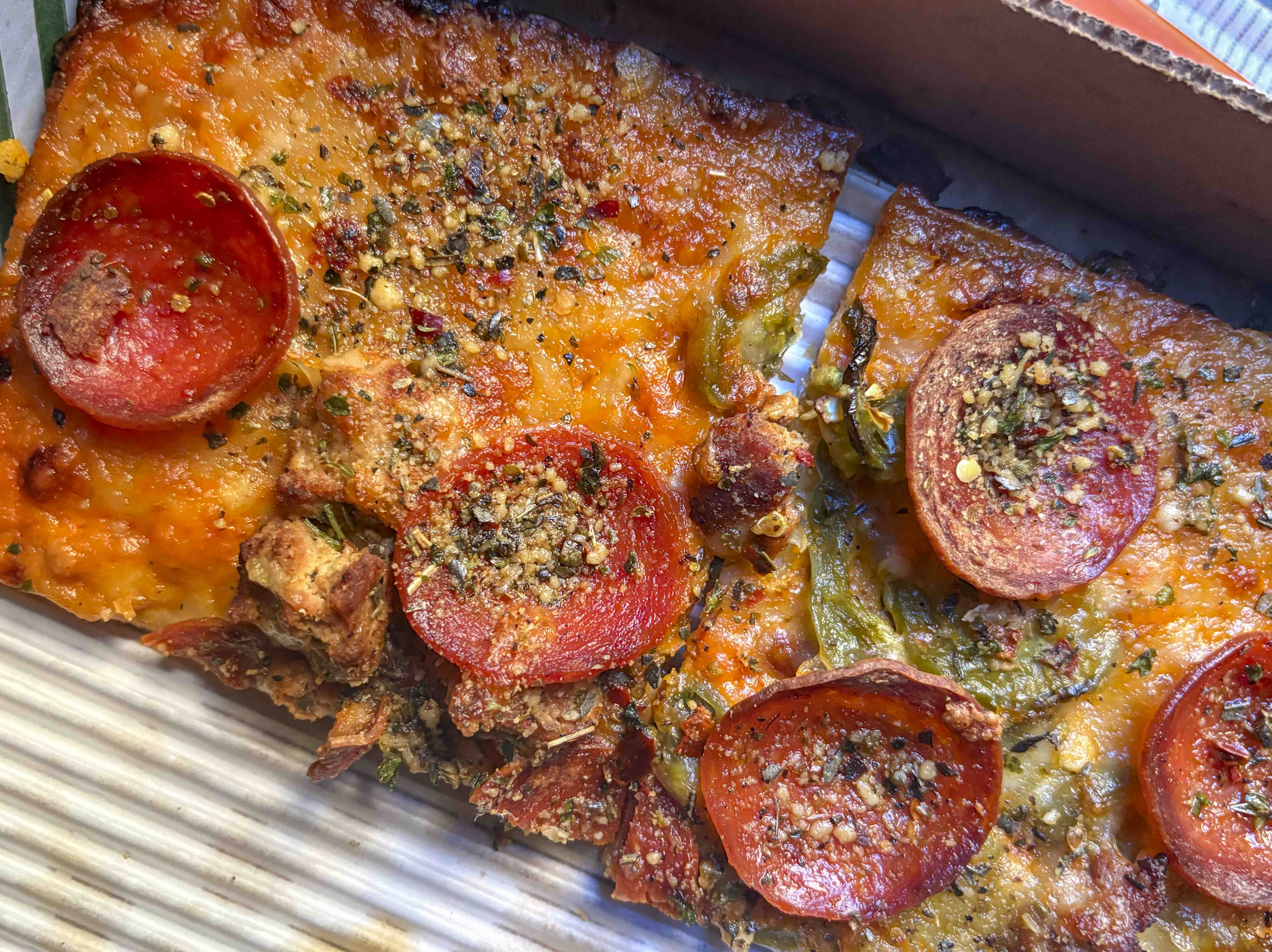 The Goopfellas pizza has a gluten-free crust, and is topped with “no-vodka sauce,” turkey sausage, pepperoni, jalapeños and a cheese blend. (Ashley Fetters Maloy/The Post)