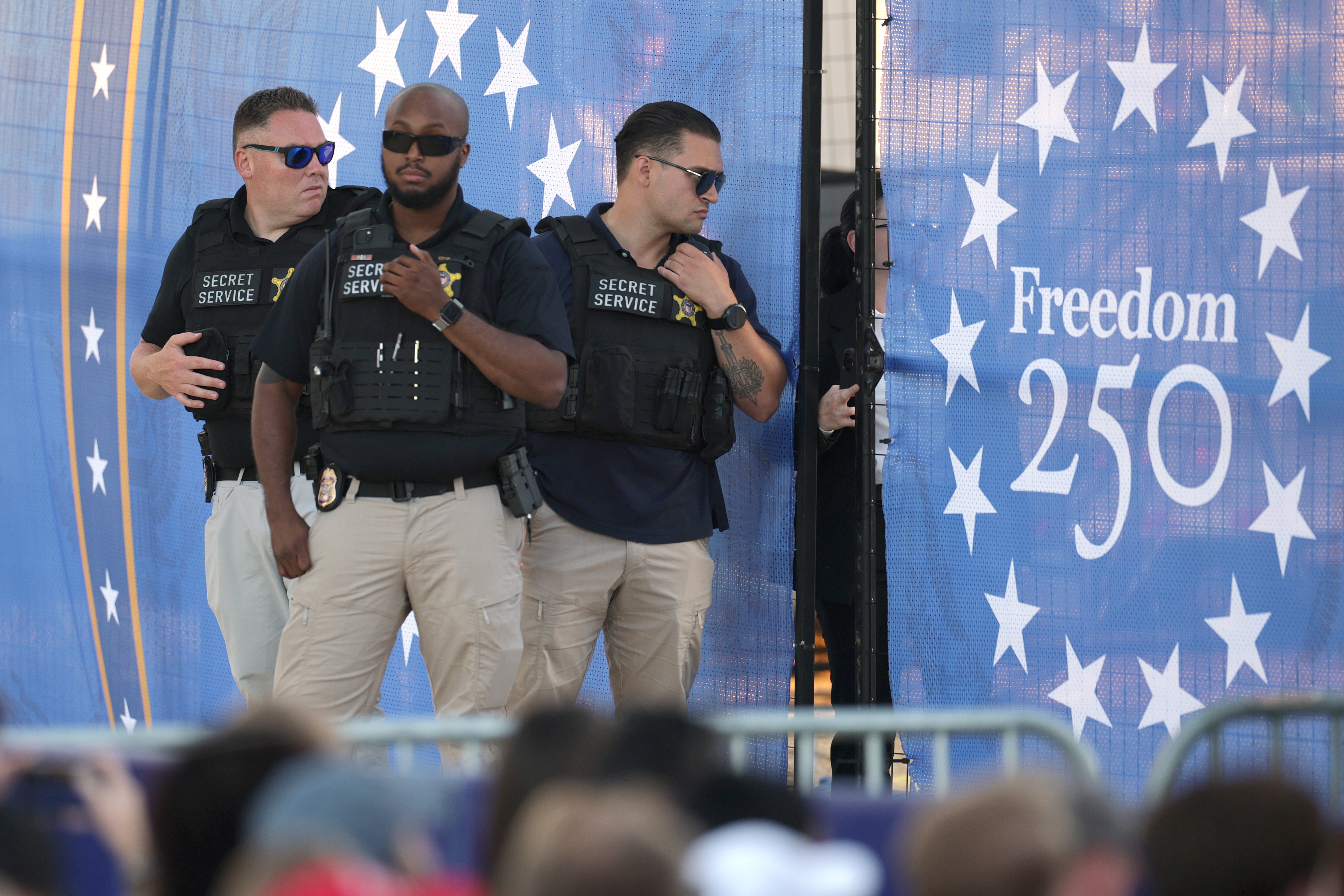 Secret Service agents are shown during a rally to kick off the Great American State Fair on the National Mall on June 24. (Chip Somodevilla/Getty Images)