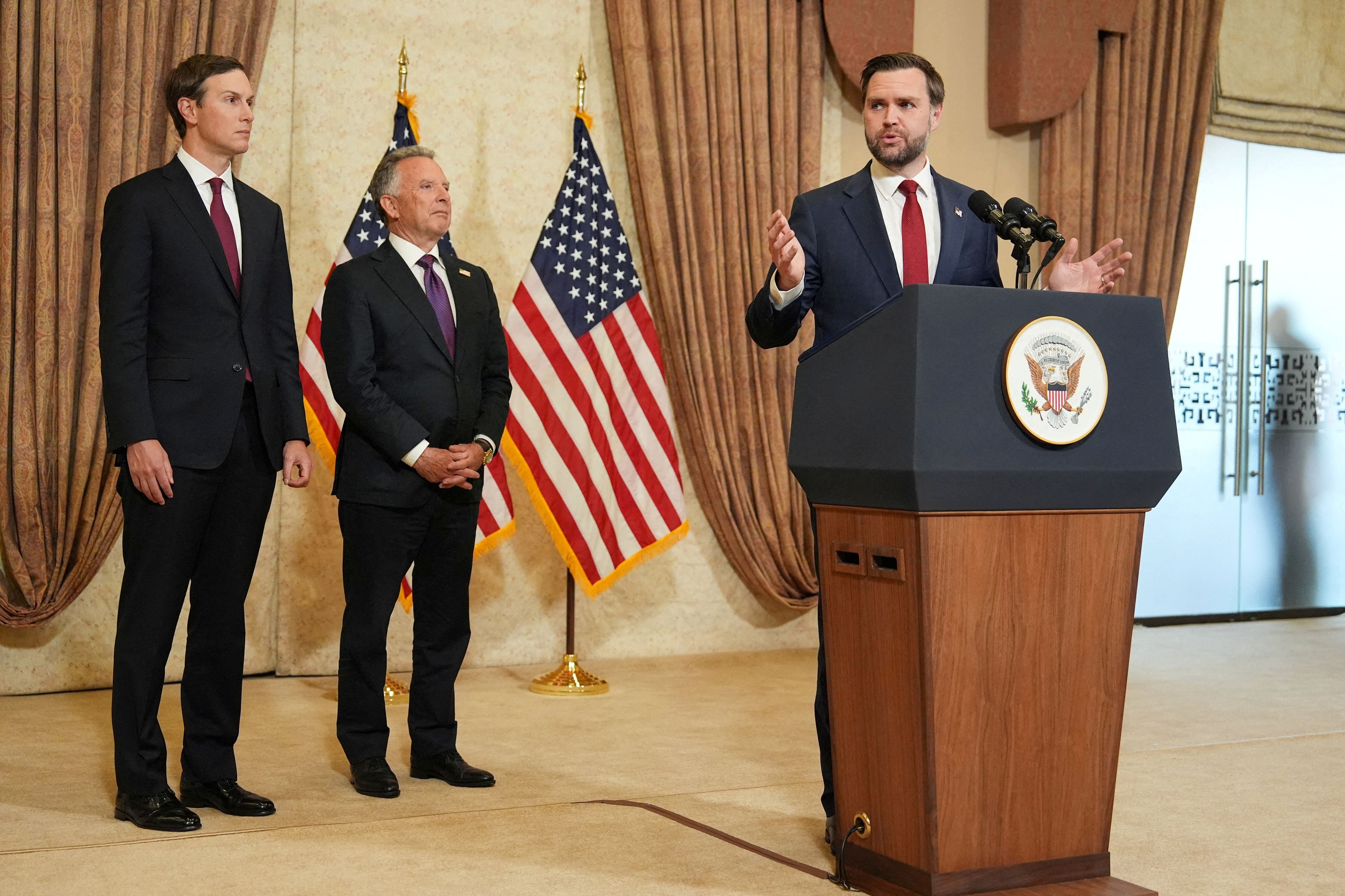 Vice President JD Vance speaks in Islamabad, Pakistan, earlier this month, with Jared Kushner, left, and Steve Witkoff in the background. (Jacquelyn Martin/Reuters)